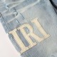 Amiri Staggered Embroidered Logo Jean Indigo / White Amiri Staggered Embroidered Logo Jean Indigo / White